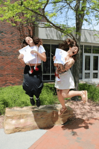 two students jumping for joy