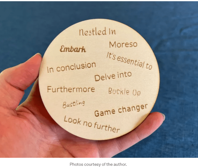 Photograph of a coaster with cliches such as "nestled in" and "delve into" on it.